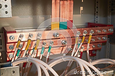 Copper busbars with electrical wires attached to them Stock Photo