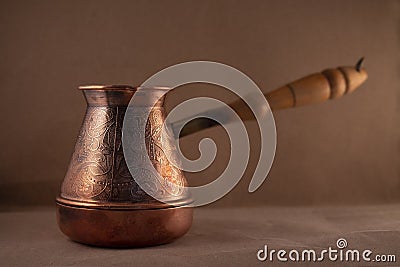 Copper coffee turk on craft background Stock Photo