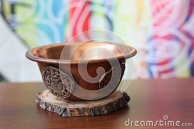 Copper Indian bowl for offerings to the gods Stock Photo