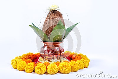 Copper Kalash with coconut , leaf and floral decoration on a white background. essential in hindu puja. Stock Photo