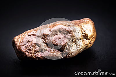 Copper nugget, a chemical element with the symbol Cu from Latin cuprum, at room temperature copper is in a solid state Stock Photo