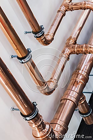 Copper pipes and fittings for carrying out plumbing Stock Photo