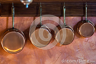 Copper saucepans set in traditional kitchen Stock Photo