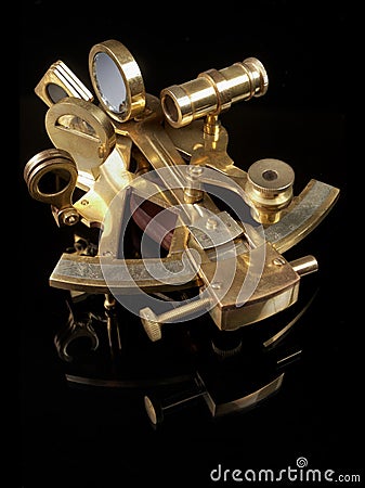 Copper sextant on black back Stock Photo