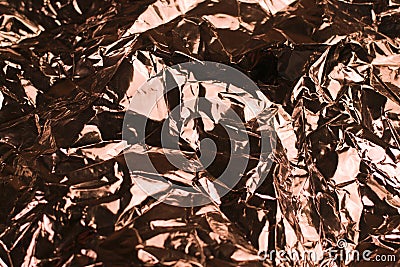 Copper shiny crinkled crumpled metal foil texture Stock Photo