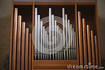 Copper and silver organ pipes Stock Photo