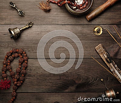 Copper singing bowl, prayer beads, prayer drum and other Tibetan religious objects Stock Photo