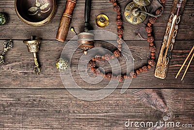 Copper singing bowl, prayer beads, prayer drum and other Tibetan religious objects Stock Photo