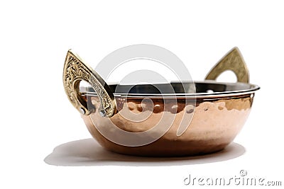 copper and stainless serving dishes (indian handi, karahi pots) white background (spoon, bowl handles) stacked Stock Photo