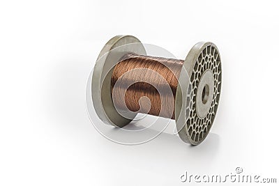 Copper wire on a reel on a white background Stock Photo