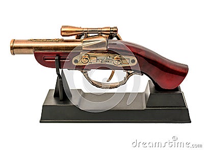 Copy of an old gun with wooden handle on a stand isolated on white background Stock Photo