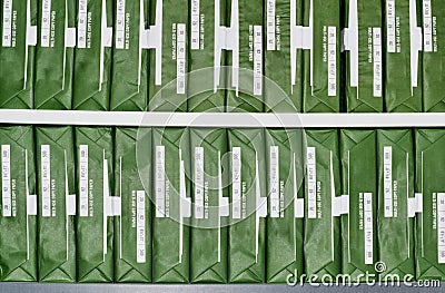 Copy paper reams with generic brand green packaging stacked up in rows. Stock Photo