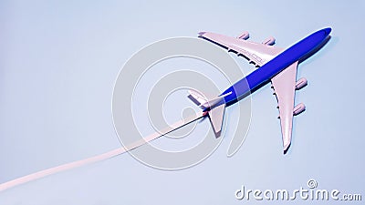 Copy space Airplane in flight on a blue background, model passenger plane Stock Photo