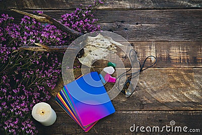 Tarot cards and esoteric decoration on a wooden background. Copy space. Esoteric concept and astrology Stock Photo