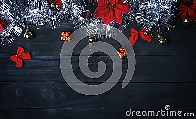 Copy Space. Silver Christmas Ornament on Black Wood Plank. Top V Stock Photo