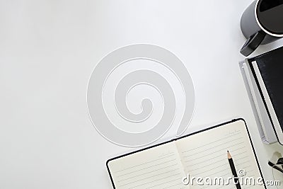 Copy space table with book, coffee cup, pencil,notebook and glasses on desk. Stock Photo