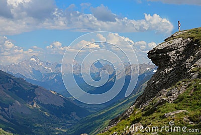 COPY SPACE: Young traveler observes the breathtaking valley in the French Alps. Stock Photo