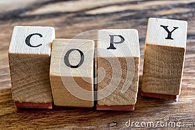 Copy Stamp on Woden Background. Copy Written in Wood Blocks. Stock Photo