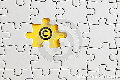 Copyright icon on missing puzzle piece Stock Photo