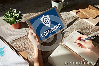 Copyright icon on screen. Patent Law and Intellectual Property. Business, Internet and Technology Concept. Stock Photo