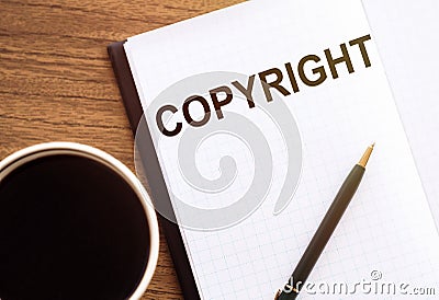 COPYRIGHT - text on notepad on wooden desk Stock Photo