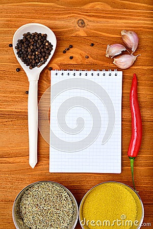 Copyspace food frame with notepad paper spices and cooking accesories Stock Photo