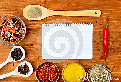 Copyspace food frame with notepad paper spices and cooking accesories Stock Photo
