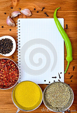 Copyspace food frame with notepad paper spices and cooking accesories Stock Photo