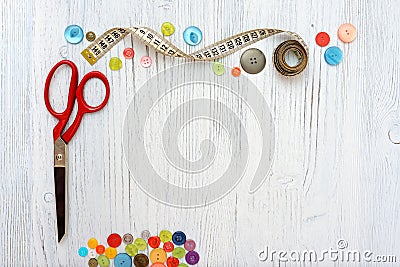 Copyspace frame with sewing tools and accesories on white wooden background Stock Photo