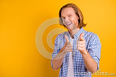 Copyspace photo of cheerful excited handsome man pointing at you being proud wearing white t-shirt smiling toothily Stock Photo