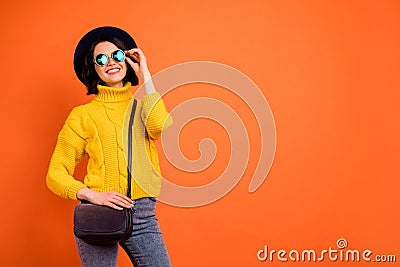 Copyspace photo of independent woman traveling alone while isolated with orange background Stock Photo