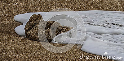 Coquina Rock Encircled by a Splash Stock Photo