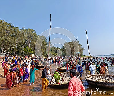 Coracles (Teppa) and locals at the beaches of Kaveri River in Talakadu Editorial Stock Photo