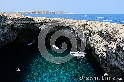 Coral lagoon with an inland sea with an arch of a collapsed cave in Mellieha, Malta Stock Photo