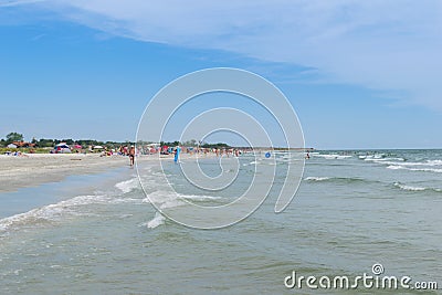 Corbu, Constanta, Romania - August 17, 2019: People enjoy a relaxing summer day on the last virging beach in Corbu, Romania Editorial Stock Photo