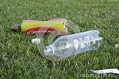 Corby, U.K., June 29, 2019 - empty plastic bottles garbage in the grass, zero waste, save planet Editorial Stock Photo