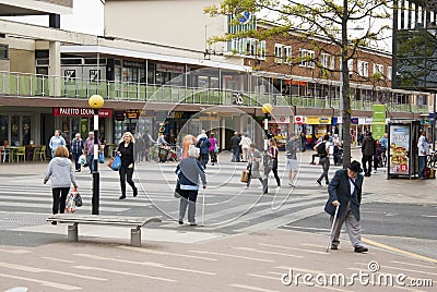 Corby, United Kingdom - august 28, 2018: Crowd of anonymous people walking on busy city street. End of summer day. Editorial Stock Photo