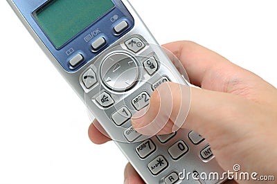 Cordless phone in hand Stock Photo