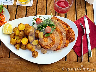 Cordon-blue with oven baked potatoes Stock Photo