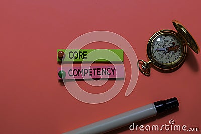 Core Competency write on sticky notes. Isolated on pink table background Stock Photo