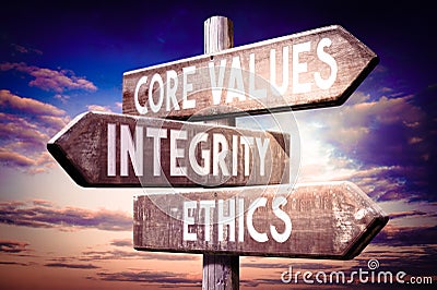 Core values, integrity, ethics - wooden signpost, roadsign with three arrows Stock Photo