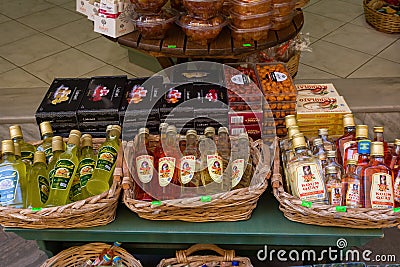 CORFU, GREECE - APRIL 7, 2018: A store that sales traditional for Corfu Island kumquat liqueur and kumquat fruits. Products from Editorial Stock Photo