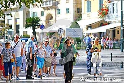 CORFU, GREECE, 18 2018, Tourists take a tour of the city accompanied by a guide Editorial Stock Photo