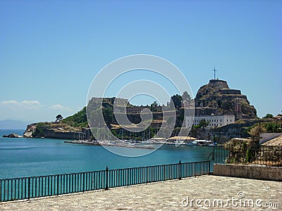 Corfu Island, Greece. Small boats port and old Kerkyra fortress in background Stock Photo
