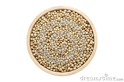 Coriander seeds in wooden bowl isolated top view on white Stock Photo