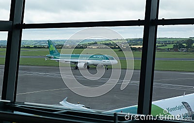 Cork airport terminal with air lingus airplane on the departure runway Editorial Stock Photo