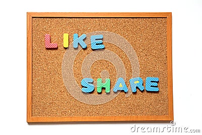 Cork board with like and share wording Stock Photo