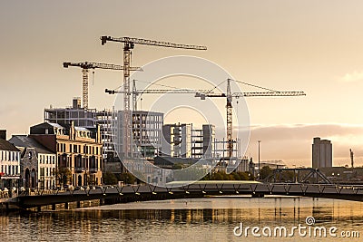 Cork Ireland industrial scenic view river Lee reflection crane building construction Stock Photo