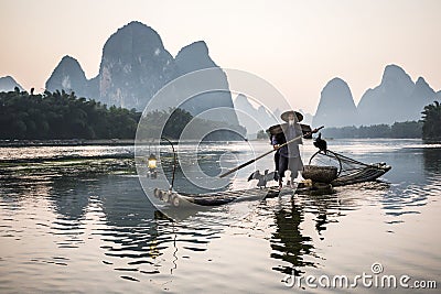 Cormorant fisherman Stock Photo