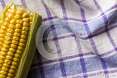 Corn Cob on bowl and rustic fabric. Food of Festa Junina, a typical brazilian party. Stock Photo